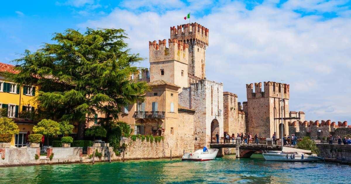 European castle along side a river 